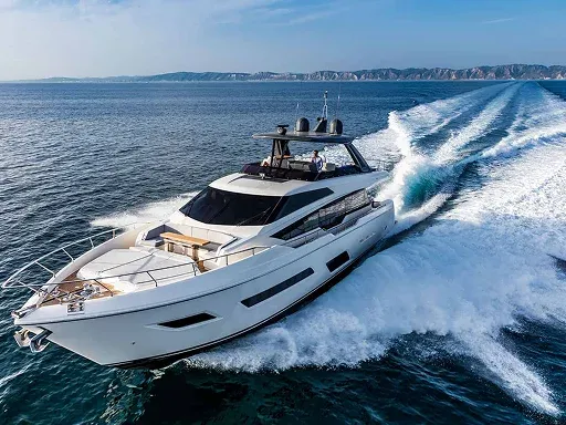A luxurious yacht speeds through calm blue waters A luxurious yacht speeds through calm blue waters