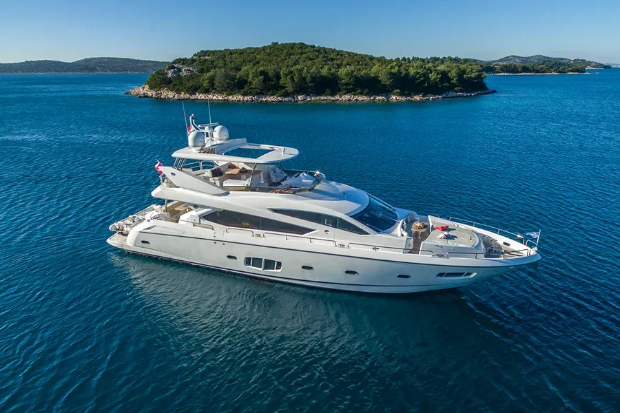 Luxury yacht anchored in clear blue water