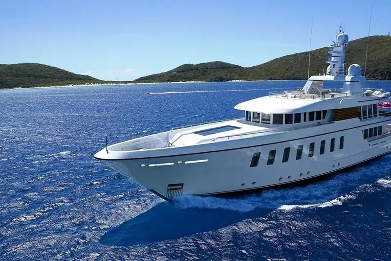 Luxury yacht sailing on blue ocean water