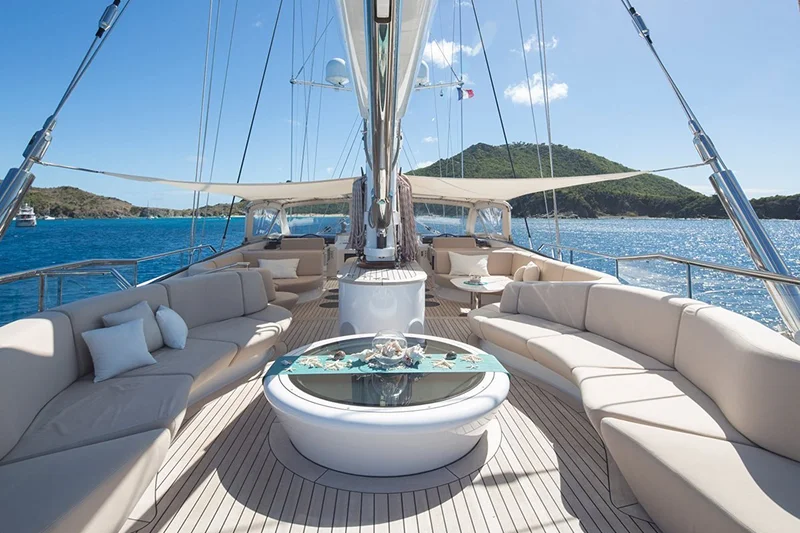 yacht deck with seating and a coastal view