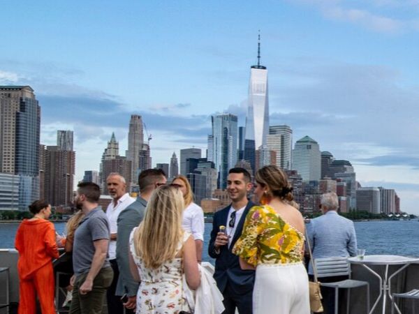 Graduation yacht party Manhattan skyline night