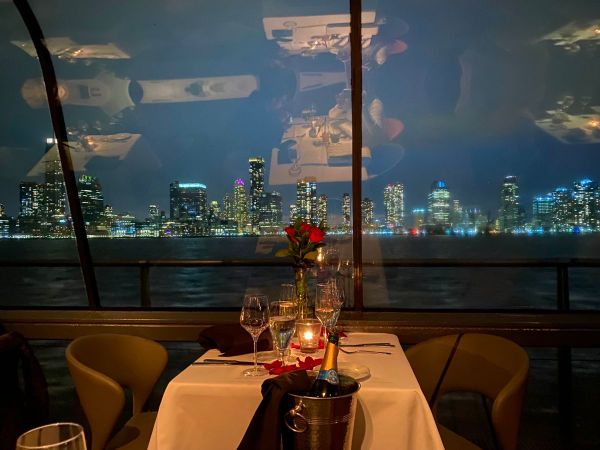 Luxury dinner yacht cruising NYC skyline