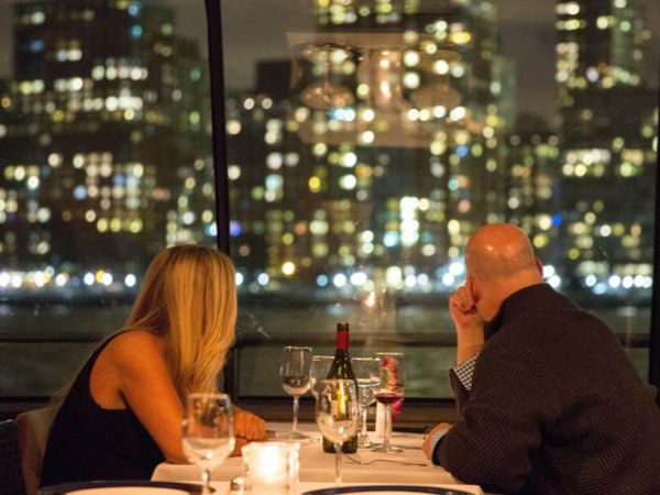 Romantic evening yacht under city lights